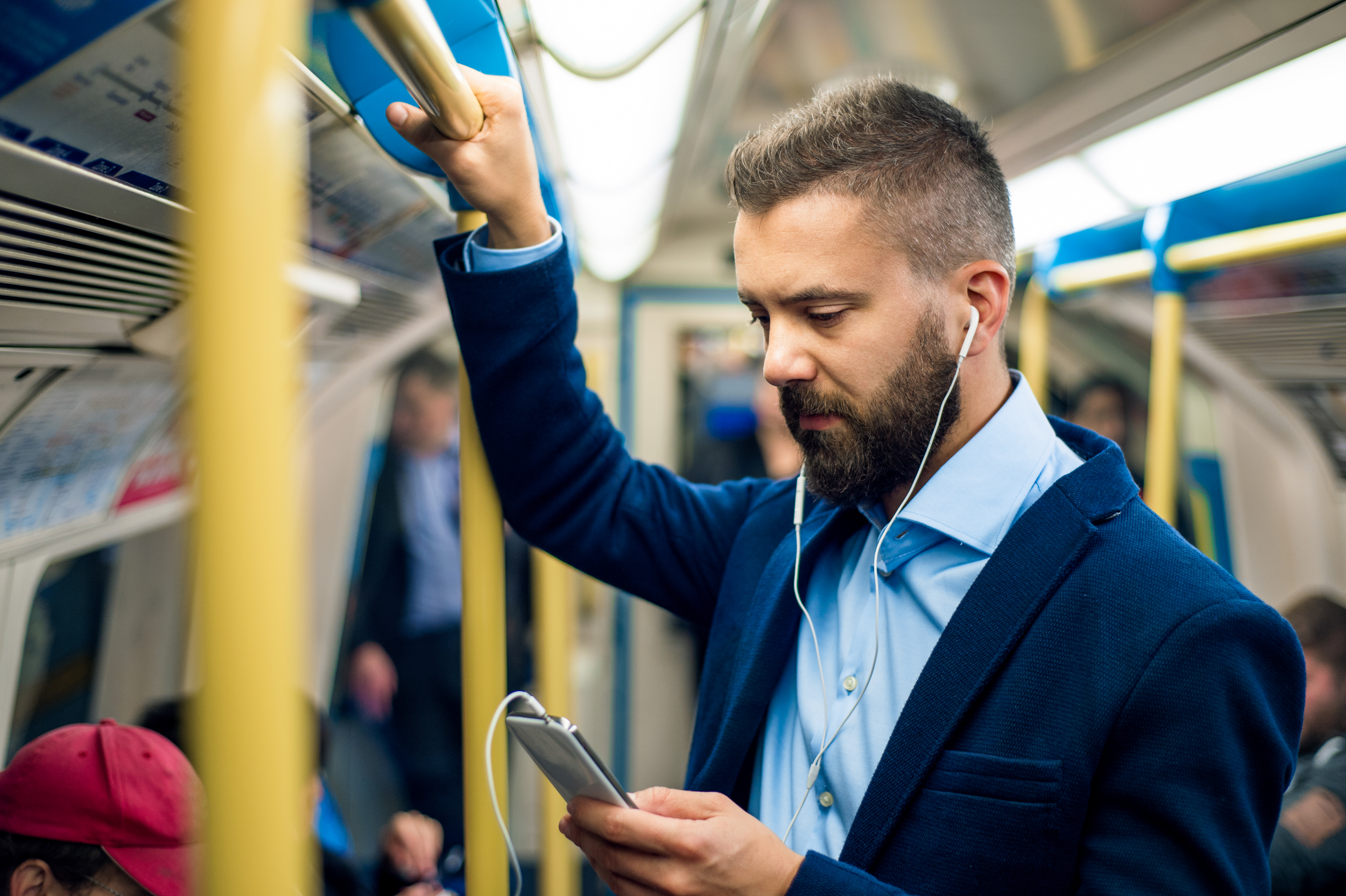 Picture of a commuter on their smartphone