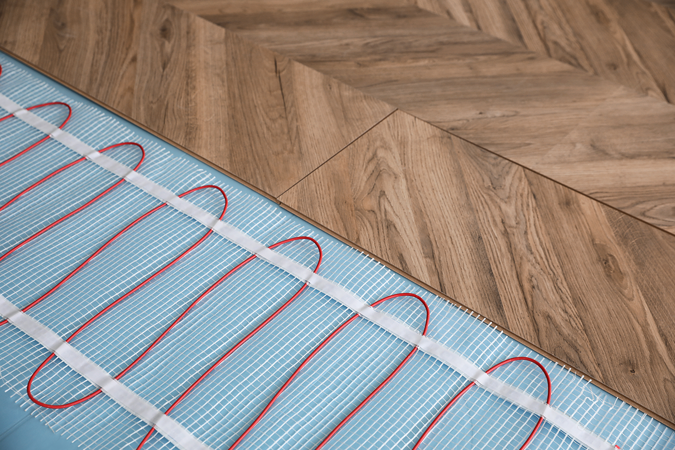 electric underfloor heating elements underneath laminate flooring