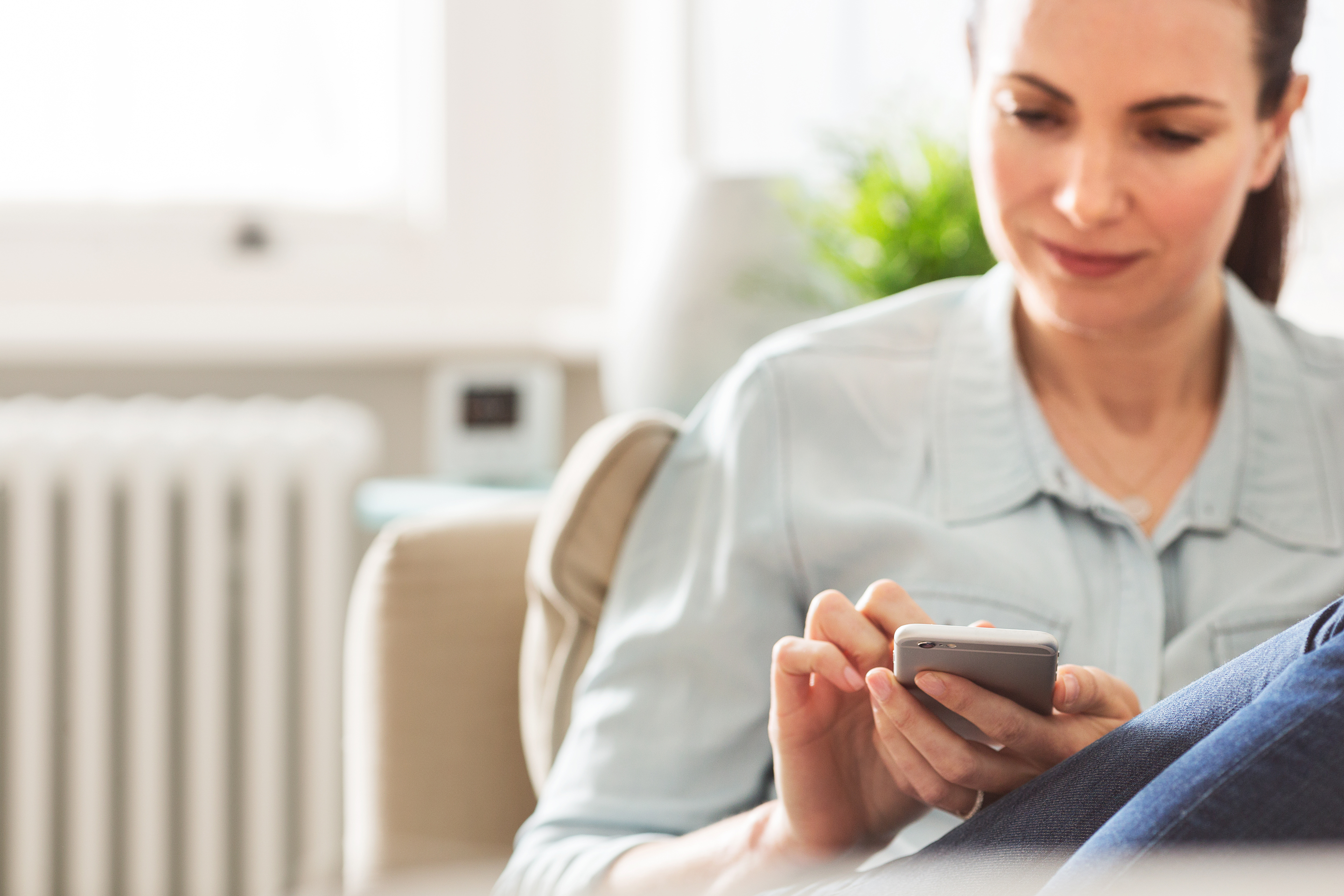 Woman using Wiser App on iPhone